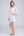 Side View: White Midi Beach Shirt with Perforated Cut Out Design