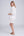 Back View: White Midi Beach Shirt with Perforated Cut Out Design