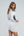 Side View: White Cotton Tunic Dress with Black Embroidery and Tassel Detail