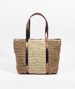 Gold straw tote bag with metallic faux leather handles, zip closure and interior pockets. Spacious summer bag for holidays, travel and shopping.