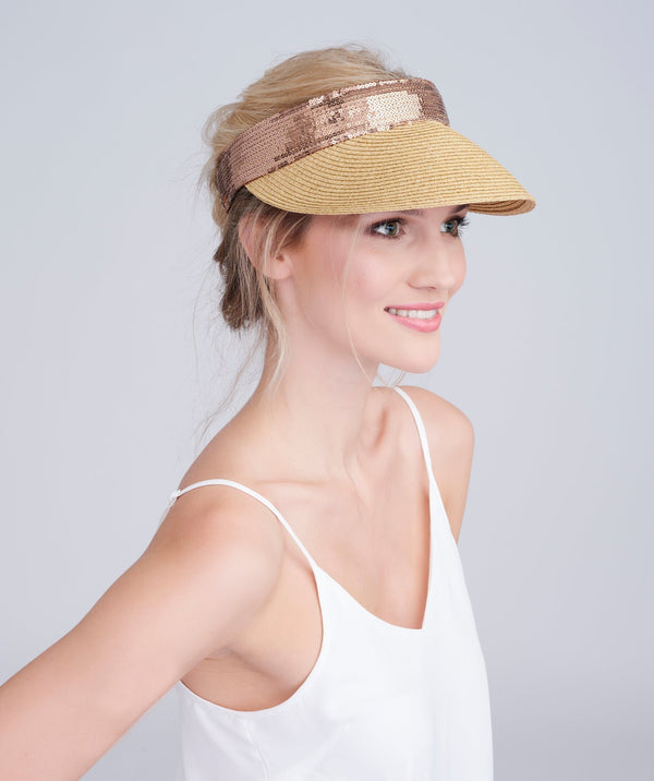 Straw visor in natural with sequin trim, elasticated fit, crushable packable design and UPF 50 sun protection for beach and summer wear.