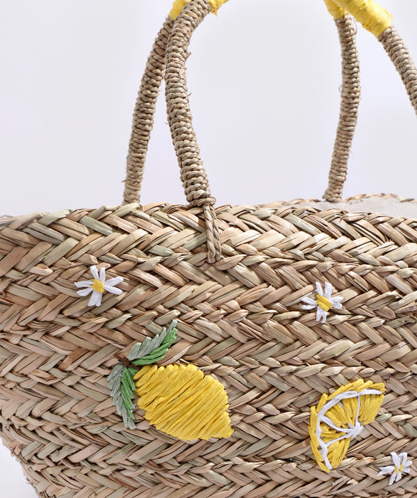 Close Up View: Sand Straw Basket Bag with Lemon Embroidered Motifs