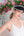 Straw visor with silver metallic stripe detail, elasticated band for adjustable fit, lightweight design for sun protection and summer outdoor wear.