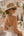 Straw wide brim sunhat with beaded trim, adjustable fit and UPF 50+ sun protection, lightweight design for beach, holiday and resort wear.