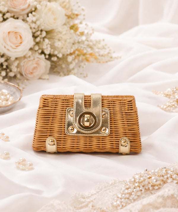 Woven rattan clutch bag with silver PU detailing, turn lock closure, detachable adjustable strap, 20cm width, compact lightweight design for day-to-night use.