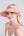 Straw visor with chiffon trim, elasticated fit and lightweight design for sun protection and summer beach or holiday wear.