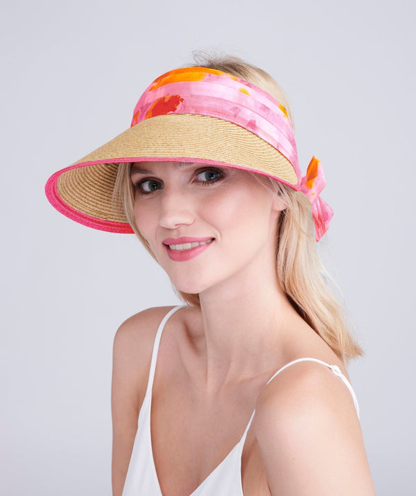 Straw visor with chiffon trim, elasticated fit and lightweight design for sun protection and summer beach or holiday wear.