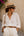 Natural straw fedora hat with ribbon trim, adjustable fit and UPF 50 sun protection for beach, holiday and summer outdoor wear.
