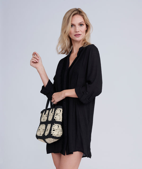 Side View: Black Fringed Beach Shirt with Button Closure and Rolled Cuff Sleeves