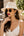 White straw fedora hat with pearl trim, adjustable fit and UPF 50 sun protection for beach, holiday and summer outdoor wear.